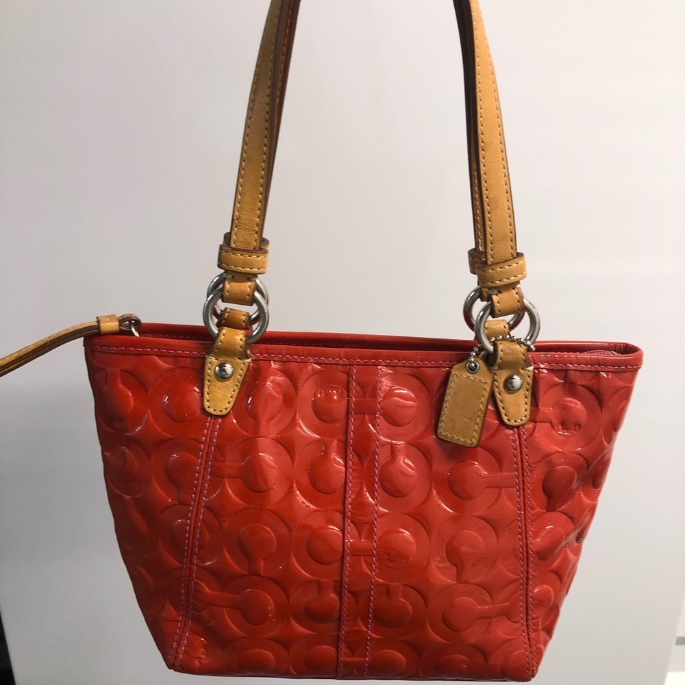 Small dark peach/ pink embossed coach bag